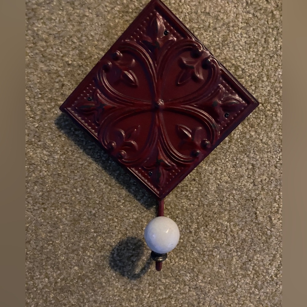 Red tile with hook.